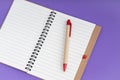 Set of recycle paper notebook and pen. Open diary notebook on prple background Royalty Free Stock Photo