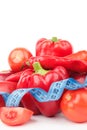 Set from red bell pepper, red hot chili pepper and apple with measuring tape Royalty Free Stock Photo
