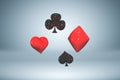 Set of red and black glossy paint card suits, flying playing card symbols, 3d rendering