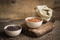 Set of red, black and mixed rice on an old wooden background Royalty Free Stock Photo