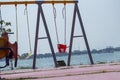 Set of red chain swings on a modern playground Royalty Free Stock Photo