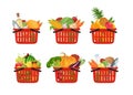 Set of Red grocery shopping baskets full of different fresh food isolated on white background. Vector illustration Royalty Free Stock Photo