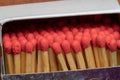 set of red head phosphor sticks inside the box aligned in parallel