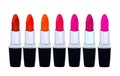Set of red lipsticks isolated on white reflective Royalty Free Stock Photo