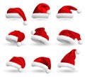 Collection of Red Santa Claus Hats isolated on white background. Set. Vector Realistic Illustration. Royalty Free Stock Photo