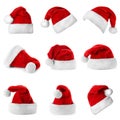 Set of red Santa Claus hats on white Royalty Free Stock Photo