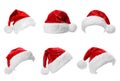 Set of red Santa Claus hats on white Royalty Free Stock Photo