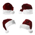 Set of red Santa Claus hats on white Royalty Free Stock Photo