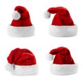 Set of red Santa Claus hats on white Royalty Free Stock Photo