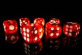 A set of red square dice on a black isolated background. Dice for playing craps or poker close up. Translucent dice with Royalty Free Stock Photo