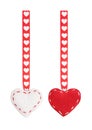 The set from red two textile hearts hanging on a ribbon with a pattern from hearts Royalty Free Stock Photo