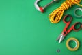 Set of repair tools on green background, flat lay Royalty Free Stock Photo