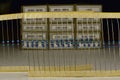 A set of resistors after dismantling electronic components next to the industrial packaging of new resistors