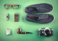 Set of Retro hipster mock up. Laptop, old camera, tablet and smoke pipe on green background. Filtered image Royalty Free Stock Photo