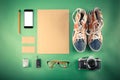 Set of Retro hipster mock up. Laptop, old camera, tablet and smoke pipe on green background. Filtered image Royalty Free Stock Photo