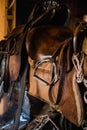 A set of riding equipment in a wooden stable at the equestrian club Royalty Free Stock Photo