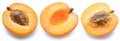 Set of ripe apricot halves on white background. File contains clipping paths