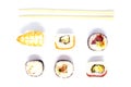 A set of rolls of different kinds with sushi sticks isolated on a black background Royalty Free Stock Photo