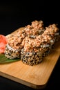 Set of rolls with red fish, sesame and caviar on a green leaf Royalty Free Stock Photo