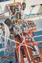 Set of ropes for management of the sailboat of different color, the signature to each rope, rollers, levers, carbines