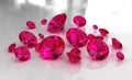 Set of round red ruby stones on glossy surface Royalty Free Stock Photo