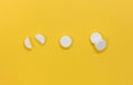 A set of round tablets. The view from the top. Isolated on a yellow background Royalty Free Stock Photo