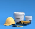 Set of safety helmet, bucket with paint rollers and brushes on blue background. Royalty Free Stock Photo