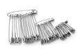 Set of safety pins on white background Royalty Free Stock Photo