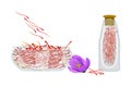 Set of saffron isolated on white background. Dried spice saffron threads in bowl and bottle.
