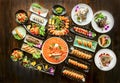 Set of salmon sushi maki and rolls, grill saba fish at black rustic wood Royalty Free Stock Photo