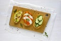 Set of sandwiches served on wooden board Royalty Free Stock Photo