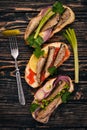 A set of sandwiches with sprats, and caviar, onion and parsley, on a wooden background. Royalty Free Stock Photo