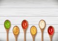 Set of sauces, ketchup, wasabi, mayonnaise in wooden spoons on background of boards.