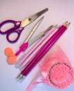 A set of school office supplies. Pink, white and purple colors