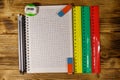 Set of school stationery supplies. Blank notepad, rulers, pencils, erasers and sharpener on wooden desk. Top view Royalty Free Stock Photo