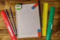 Set of school stationery supplies. Blank notepad, rulers, pencils, erasers and sharpener on wooden desk. Top view Royalty Free Stock Photo