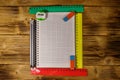 Set of school stationery supplies. Blank notepad, rulers, pencils, erasers and sharpener on wooden desk. Top view Royalty Free Stock Photo