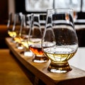 Scotch whisky, tasting glasses with variety of single malts or blended whiskey spirits on distillery tour in Scotland