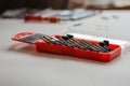 A set of screwdriver bits on a light surface. Covered orange con Royalty Free Stock Photo