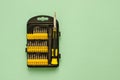 A set of screwdrivers for precision work on green background Royalty Free Stock Photo