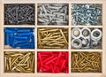 Set screws, screws, dowels in the box Royalty Free Stock Photo