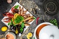 set of seafood shrimp, fish, crayfish, mussels and soup on a dark background. Restaurant menu, dieting, cookbook recipe top view Royalty Free Stock Photo