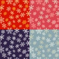 Set of Seamless pattern of snowflakes on a red, blue, pink and grey background Royalty Free Stock Photo