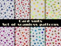 Set of seamless patterns with suits of playing cards.