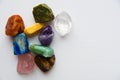 Set of semiprecious stones on a white background, on a white textured canvas.