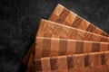 Set of several cutting boards on a dark background