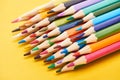 Set of sharpened color pencils on yellow background. Royalty Free Stock Photo