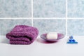 Set of shaving accessories on a white table