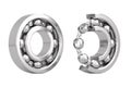Set of Shiny Chrome Steel Ball Bearings with One Cut Outed Where Visible the Inner Parts. 3d Rendering Royalty Free Stock Photo
