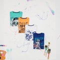 Set of shirts in different colors and colorful prints for children Royalty Free Stock Photo